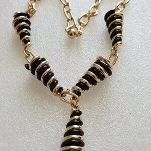 A Gold & Black say a twirly cone necklace, great condition,wt33 grams item#A-35